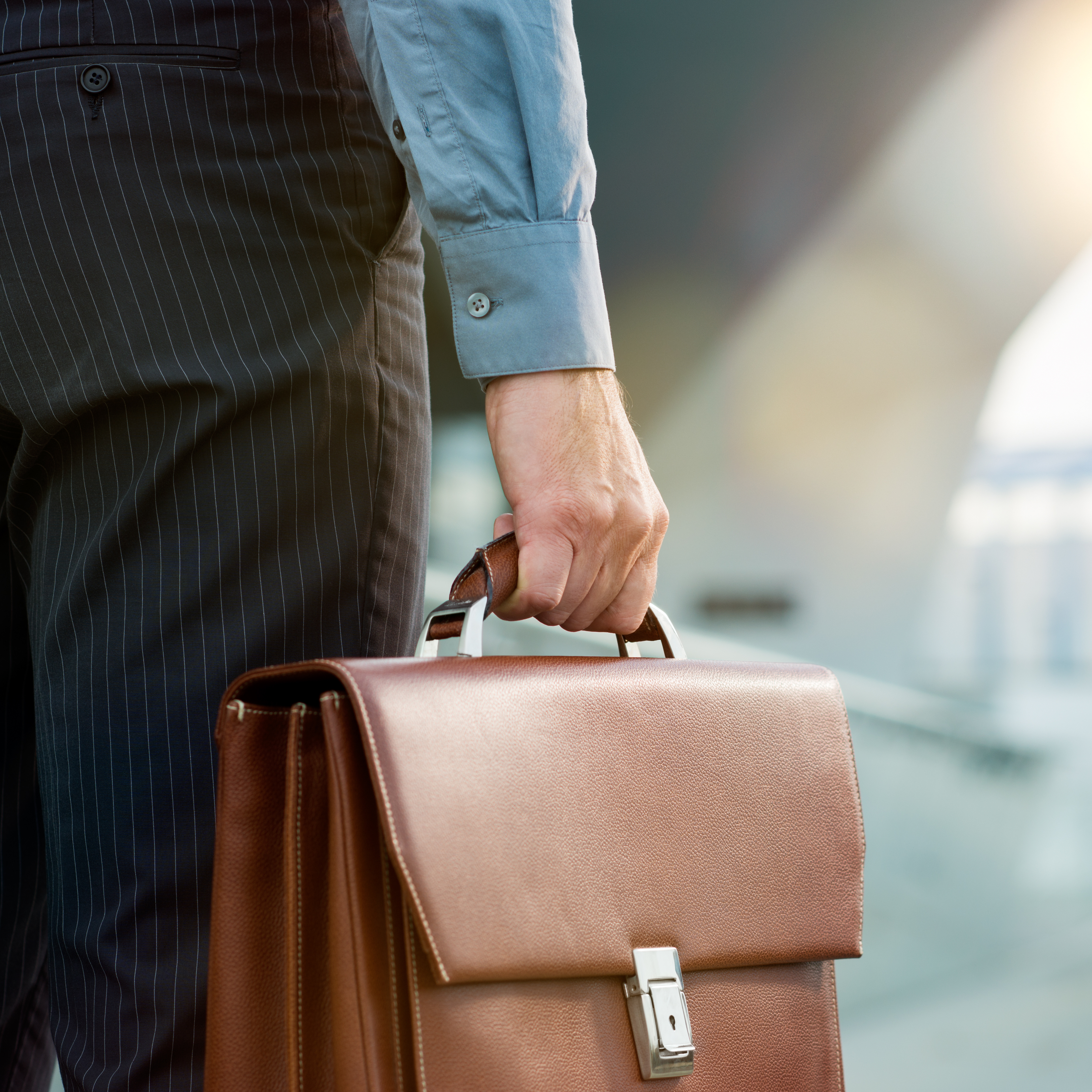 An expert DUI attorney holding a briefcase - contact Branson West Law to learn what to do if you get a DUI in Utah.