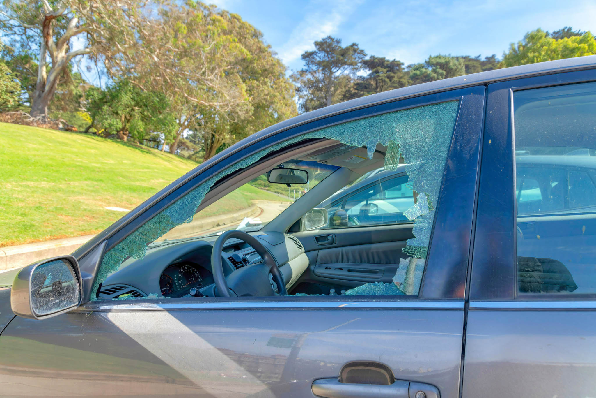 A broken car window which can be classified as a criminal michief charge in Utah.