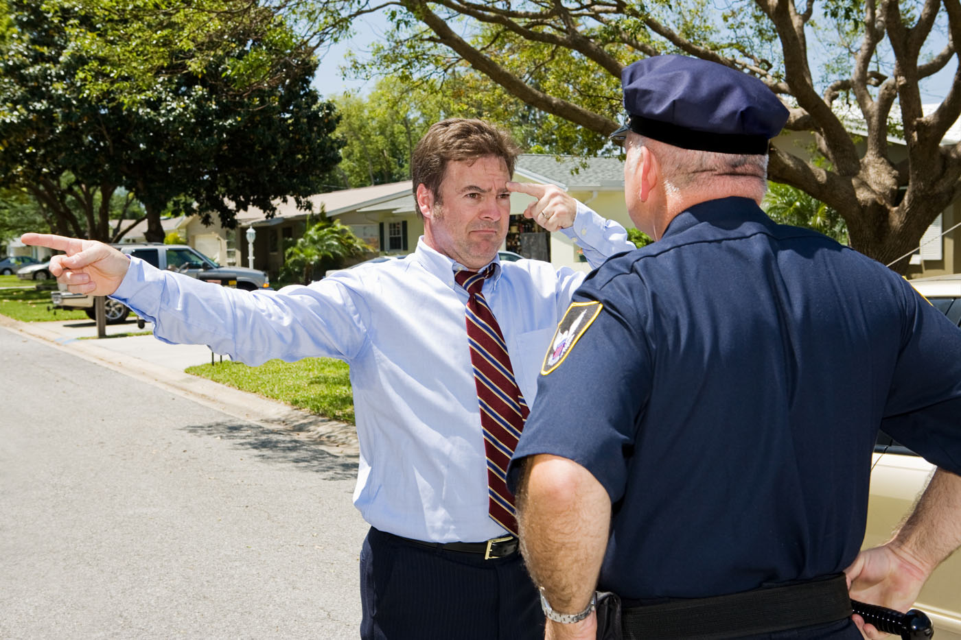 A man in a suit doing a sobriety test - if you are in need of a traffic violation lawyer in Utah, contact Branson West Law!