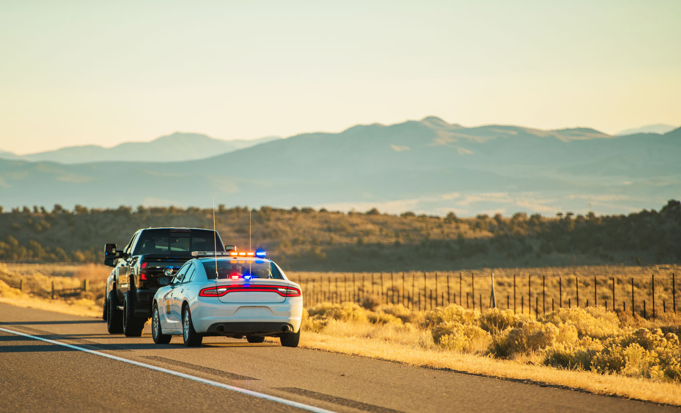 A car being pulled over for a DUI - if you are in need of a DUI defense lawyer in Utah, contact Branson West Law!