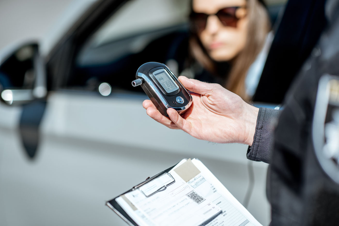 A police officer ready to adminster a breath test during a DUI - for more information on how to fight against a breath and DUI blood test in Utah, contact Branson West Law.